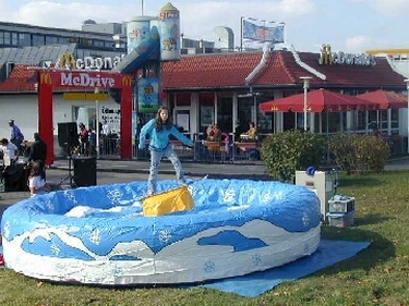 Snowboard in centre of inflatable bed