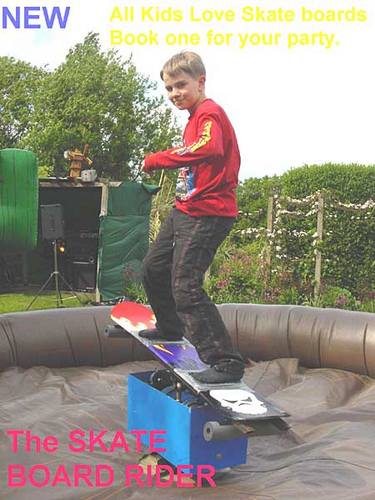 Skate board simulator on inflatable bouncy safety bed