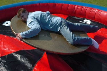 Human plays the role of the ball on the inflatable roulette wheel