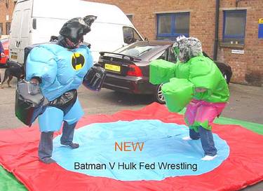 Wrestling in Batman and the Hulk costumes