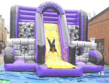 Climb the inflatable wall and then down the slide