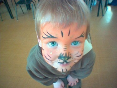 Tradition face painting with sponge and brush