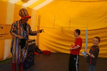 Magician/Children's entertainer performing for a seated audience